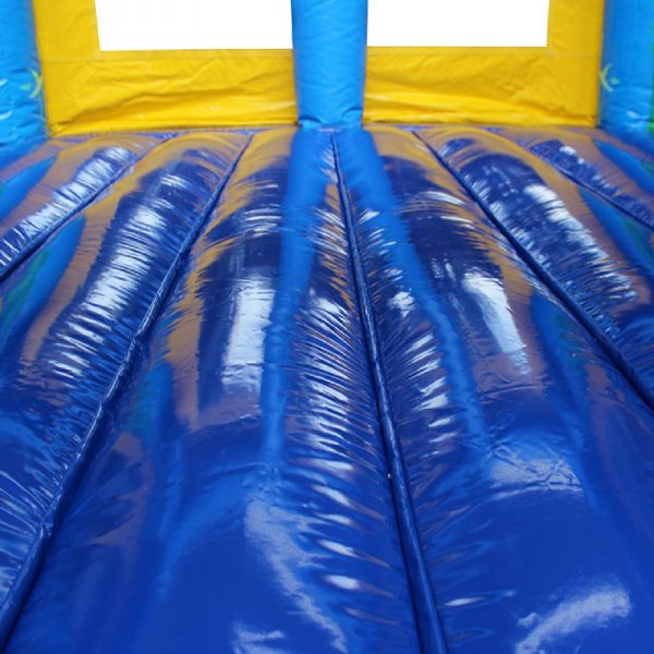 Blue and yellow bouncy castle jumping area.