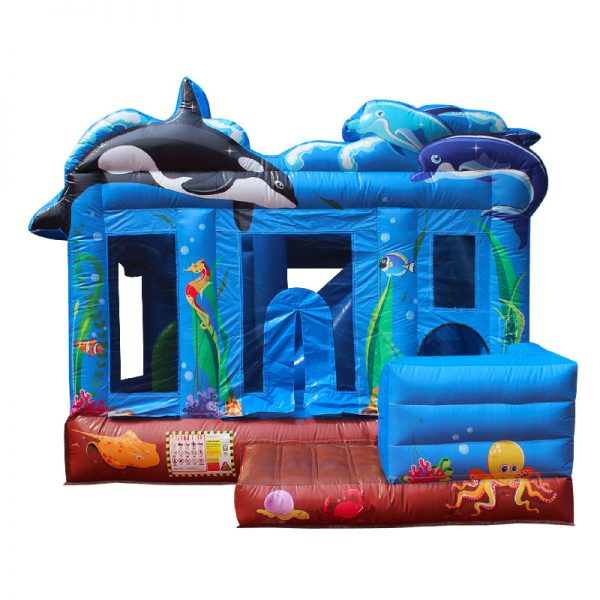 Sea themed inflatable bounce house featuring an Orca whale, dolphins and other sea creatures.