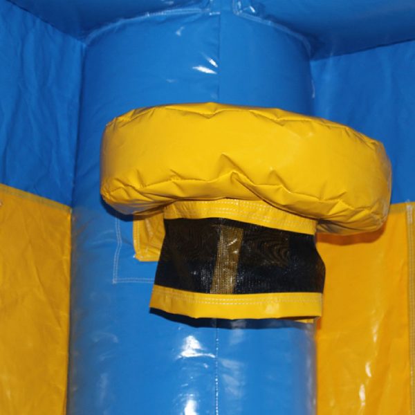 Yellow basketball hoop with a black netting on the corner column of a blue bouncy castle.